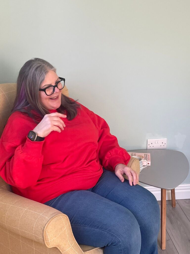 Michelle sitting in her therapy chair