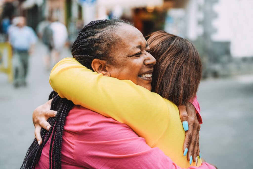 two women embracing in hug
